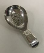 A heavy unusual bright sut silver caddy spoon with