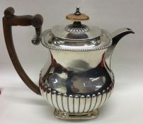 A good heavy George III silver coffee pot of half