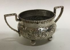 An Edwardian silver two handled bowl on ball feet.