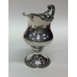 A George III silver g=cream jug with textured bord