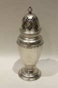 An Edwardian silver caster with panelled sides. Sh