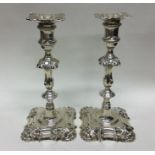 A good pair of cast silver candlesticks of typical
