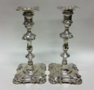 A good pair of cast silver candlesticks of typical