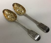 A pair of heavy fiddle pattern silver berry spoons