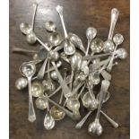 A bag containing a large collection of salt spoons