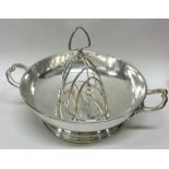 A Georgian style silver plated shallow dish togeth