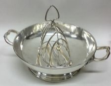 A Georgian style silver plated shallow dish togeth