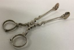 A pair of Georgian silver sugar scissors. London 1