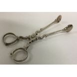 A pair of Georgian silver sugar scissors. London 1