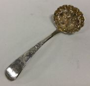 NEWCASTLE: A crested silver berry sifter spoon. 18