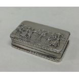 An Edwardian chased silver snuff box depicting a r