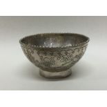 A Chinese chinoiserie silver bowl with beaded rim.