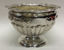 A chased silver half fluted rose bowl with gilt in