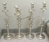 A rare Georgian silver suite of candelabra and can