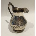 An attractive Victorian silver embossed cream jug