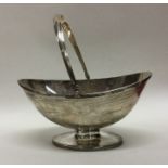 A heavy squat silver sugar basket decorated with s