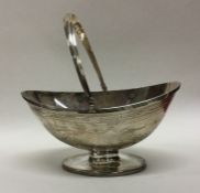 A heavy squat silver sugar basket decorated with s