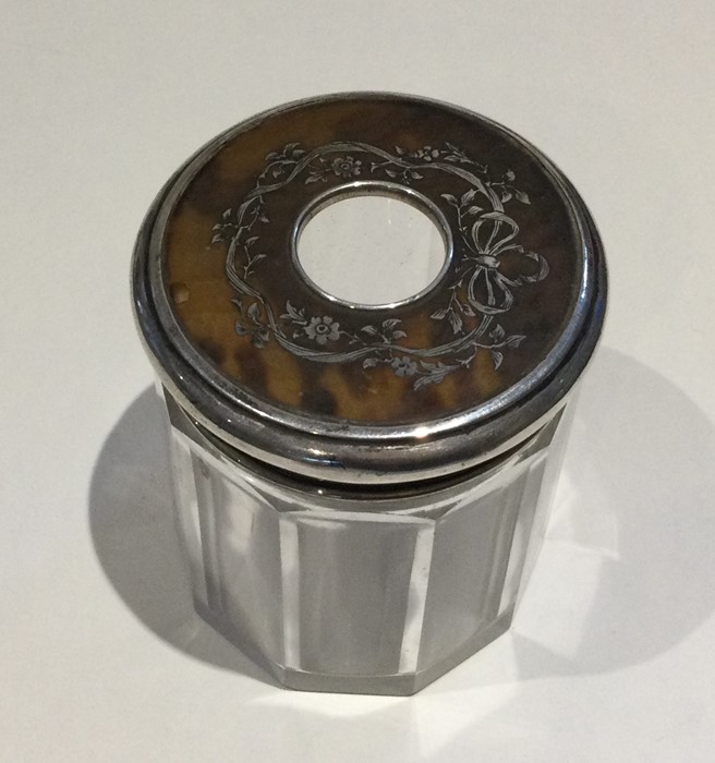 A silver and tortoiseshell lidded glass pin jar wi