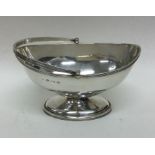 An Edwardian silver swing handled sugar basket. Bi