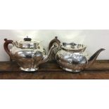 An Edwardian silver plated half fluted teapot toge