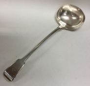 A heavy crested fiddle pattern silver soup ladle.