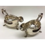 A pair of heavy Georgian silver sauce boats with c