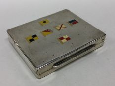 A novelty silver box decorated with nautical flags