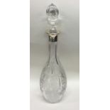 A large silver and etched glass decanter with lift