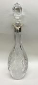 A large silver and etched glass decanter with lift