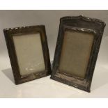 Two good silver picture frames with shaped edges.