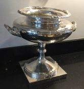 A massive silver two handled trophy cup with reede