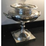 A massive silver two handled trophy cup with reede