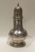 An Edwardian baluster shaped silver sugar caster w