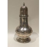 An Edwardian baluster shaped silver sugar caster w