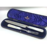 A cased silver and MOP bread knife and fork. Sheff