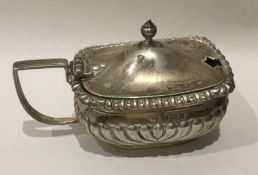 An Edwardian silver mustard with gadroon rim toget