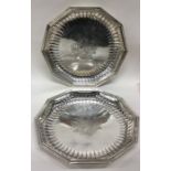 A rare pair of George II silver serving dishes wit