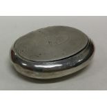 A squeeze sided silver tobacco box with engine tur