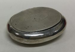 A squeeze sided silver tobacco box with engine tur