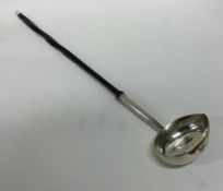 A large George II silver toddy ladle with whalebon