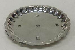 An Edwardian silver pin dish with shaped border. L