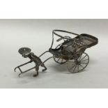 A Chinese silver model of a man and cart. Punched