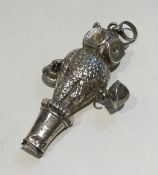 An unusual silver rattle in the form of an owl wit