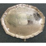 A heavy Victorian silver salver attractively decor