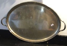 A large oval Georgian silver two handled tray with