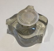 An unusual silver and glass mounted shaped inkwell