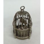 A Dutch figure of a bird in cage with pierced deco