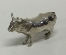 A novelty silver figure of a cow in standing posit