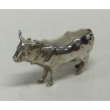 A novelty silver figure of a cow in standing posit