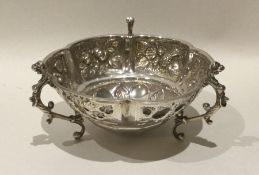 An embossed silver sweet dish decorated with flowe